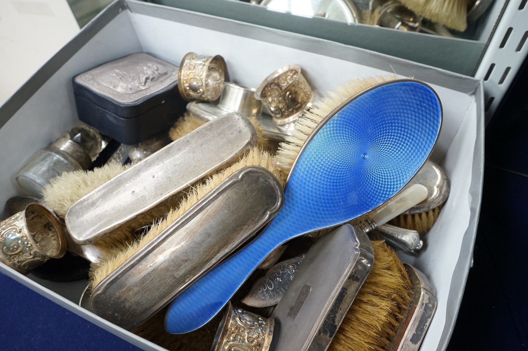 A quantity of assorted silver items including four silver and enamel clothes or hair brushes by Charles S. Green & Co Ltd, Birmingham, 1923, nine other mounted dressing table items, a Victorian christening trio, a set of